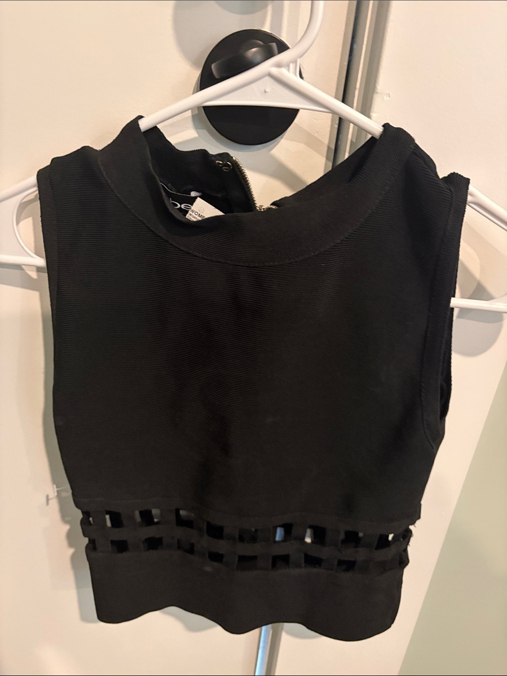 Sleeveless Black Bebe Top with Cutout Waist Detail